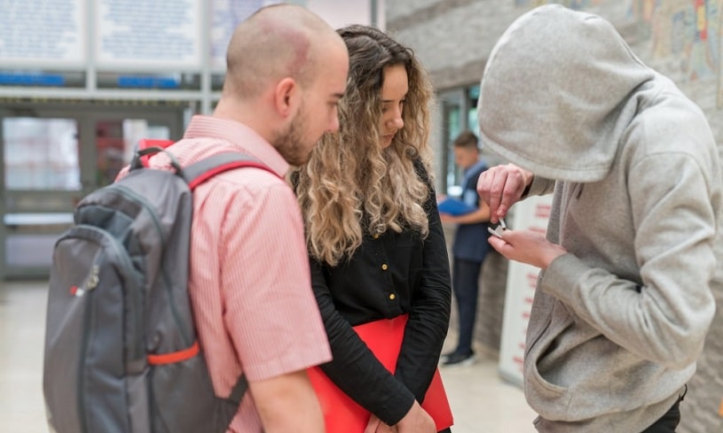 Teens using drugs at school.