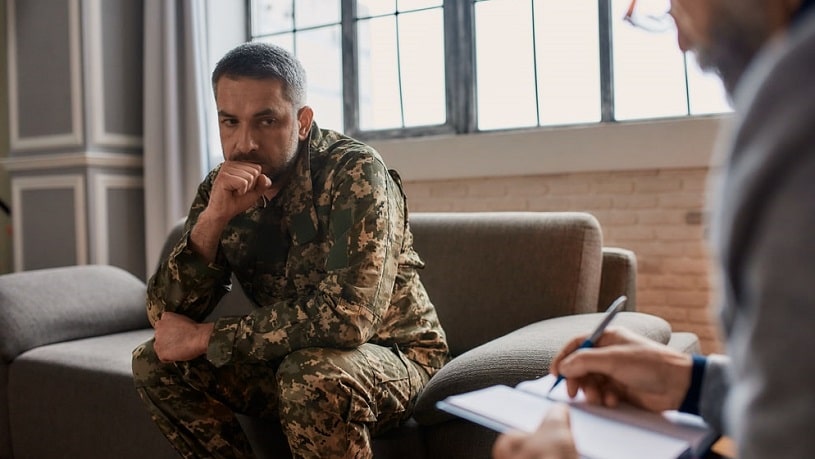 Veteran with PTSD and substance abuse problems talking to a specialist.