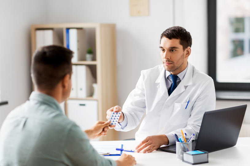 A medical doctor gives paxill pills to a patient.
