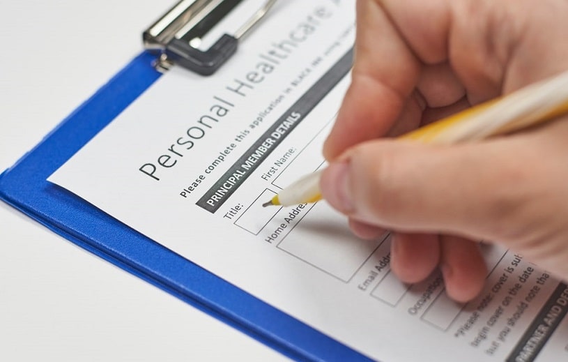 Patient filling in an application for insurance.