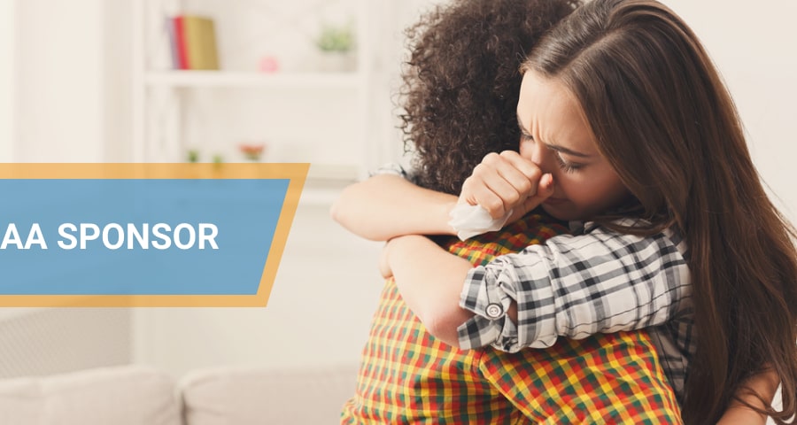 Woman hug her AA sponsor.