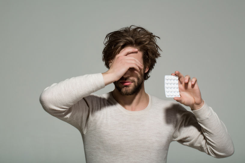 A man holds antidepressant drugs.